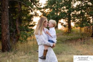 Littleton family photographer in Colorado at Mt. Falcon park mountain views view of foothills boy mother father son love summer sunset natural light photography