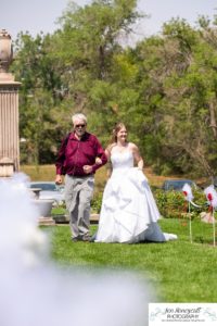 Littleton wedding photographer in Colorado at the War Memorial Rose Garden Bemis summer ceremony gazebo red roses bride groom in love bridesmaids groomsmen dress white COVID outdoors natural light