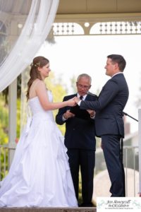 Littleton wedding photographer in Colorado at the War Memorial Rose Garden Bemis summer ceremony gazebo red roses bride groom in love bridesmaids groomsmen dress white COVID outdoors natural light