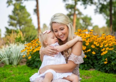 Littleton family photographer Colorado Highlands Ranch Mansion mother daughter flowers hugs snuggle love