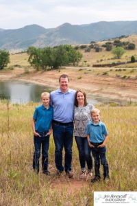 Littleton family photographer in Colorado at South Valley Open space park in Ken Caryl red rocks rock formations rain wind storm summer sunset boys brothers mother father son photography photo session