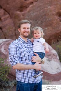 Littleton family photographer one year old boy son father mother porch session home red rocks rock formations Bradford Perley house Ken Caryl Valley toddler walking cute baby