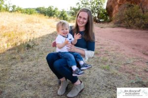 Littleton family photographer one year old boy son father mother porch session home red rocks rock formations Bradford Perley house Ken Caryl Valley toddler walking cute baby