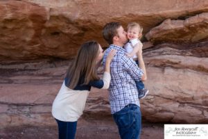 Littleton family photographer one year old boy son father mother porch session home red rocks rock formations Bradford Perley house Ken Caryl Valley toddler walking cute baby