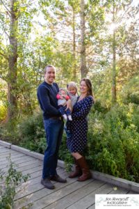 Littleton family photographer Fly'N B park Highlands Ranch fall color change trees baby girl sisters two years old water mother father daughter