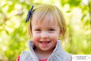 Littleton family photographer Fly'N B park Highlands Ranch fall color change trees baby girl sisters two years old water mother father daughter