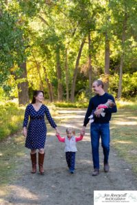 Littleton family photographer Fly'N B park Highlands Ranch fall color change trees baby girl sisters two years old water mother father daughter