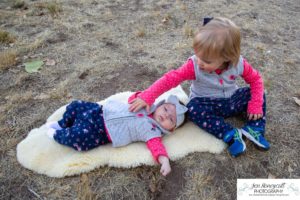 Littleton family photographer Fly'N B park Highlands Ranch fall color change trees baby girl sisters two years old water mother father daughter