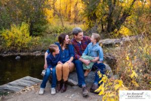 Littleton family photographer Lair O' the Bear Colorado fall Morrison yellow trees mother father son daughter big brother little sister creek love natural light photography