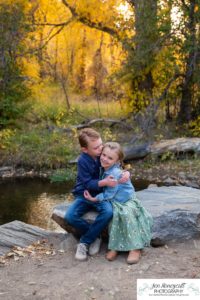 Littleton family photographer Lair O' the Bear Colorado fall Morrison yellow trees mother father son daughter big brother little sister creek love natural light photography