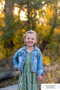 Littleton family photographer Lair O' the Bear Colorado fall Morrison yellow trees mother father son daughter big brother little sister creek love natural light photography