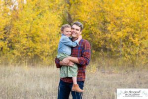 Littleton family photographer Lair O' the Bear Colorado fall Morrison yellow trees mother father son daughter big brother little sister creek love natural light photography