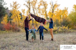 Littleton family photographer Lair O' the Bear Colorado fall Morrison yellow trees mother father son daughter big brother little sister creek love natural light photography