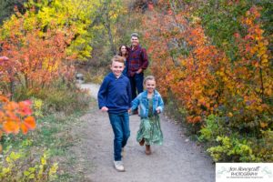 Littleton family photographer Lair O' the Bear Colorado fall Morrison yellow trees mother father son daughter big brother little sister creek love natural light photography