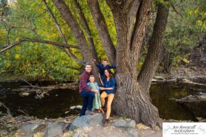 Littleton family photographer Lair O' the Bear Colorado fall Morrison yellow trees mother father son daughter big brother little sister creek love natural light photography