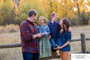 Littleton family photographer Lair O' the Bear Colorado fall Morrison yellow trees mother father son daughter big brother little sister creek love natural light photography