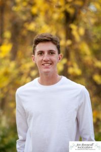 Littleton high school senior photographer at Fly'N B park in Highlands Ranch Colorado Castle Rock college bound baseball player boy bat glove handsome natural light photography sunrise session