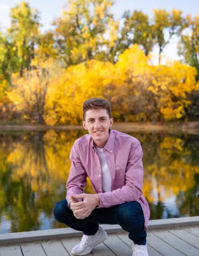 Littleton high school senior photographer at Fly'N B park in Highlands Ranch Colorado Castle Rock college bound baseball player boy bat glove handsome natural light photography sunrise session