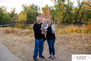 Littleton family photographer Lakewood Stone House bridge happy baby two year old mother father daughter little girl fall photography session outdoor natural light photo