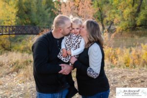 Littleton family photographer Lakewood Stone House bridge happy baby two year old mother father daughter little girl fall photography session outdoor natural light photo