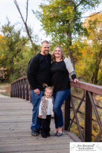 Littleton family photographer Lakewood Stone House bridge happy baby two year old mother father daughter little girl fall photography session outdoor natural light photo