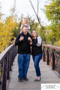 Littleton family photographer Lakewood Stone House bridge happy baby two year old mother father daughter little girl fall photography session outdoor natural light photo