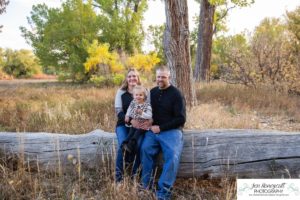 Littleton family photographer Lakewood Stone House bridge happy baby two year old mother father daughter little girl fall photography session outdoor natural light photo