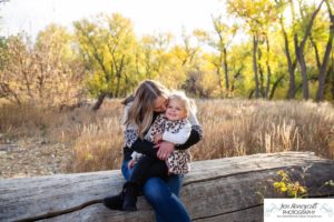 Littleton family photographer Lakewood Stone House bridge happy baby two year old mother father daughter little girl fall photography session outdoor natural light photo