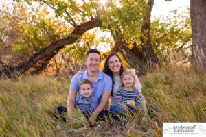 Littleton family photographer Crown Hill park Colorado fall twins brother sister mother father son daughter boy girl yellow leaves trees lake foothills natural light sunset photography fun games smiles