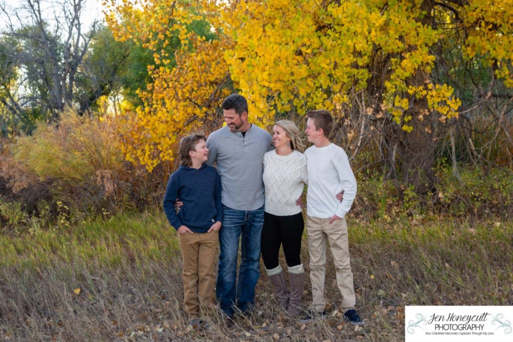 Littleton family photographer Platte River fall leaves boys brothers Colorado Dakota Ridge High School Carson Nature Center Aspen Grove yellow trees leaves baseball player boys mother father sons natural light sunset photography