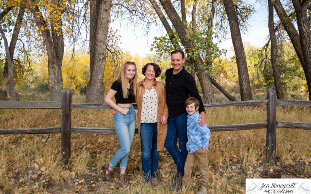 The {S} family for a fall family photo session along the Platte River by Littleton photographer