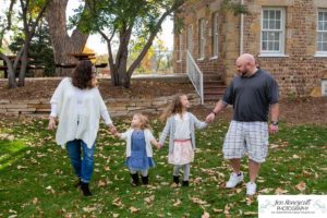 Littleton family photographer Stone House in Lakewood Colorado fall photo session sisters little girls mother father daughters bridge