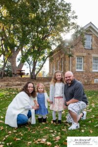 Littleton family photographer Stone House in Lakewood Colorado fall photo session sisters little girls mother father daughters bridge