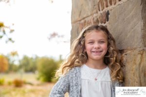 Littleton family photographer Stone House in Lakewood Colorado fall photo session sisters little girls mother father daughters bridge