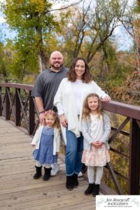 Littleton family photographer Stone House in Lakewood Colorado fall photo session sisters little girls mother father daughters bridge