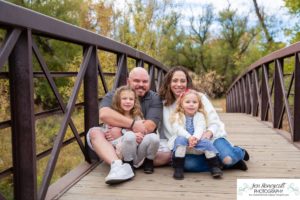 Littleton family photographer Stone House in Lakewood Colorado fall photo session sisters little girls mother father daughters bridge