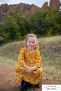 Littleton family photographer at Roxborough State Park in Colorado boy brother big little sister sisters kids children silly fun foothills sunset natural light photography photo session mother father son daughter portrait