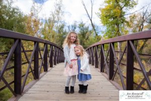 Littleton family photographer Stone House in Lakewood Colorado fall photo session sisters little girls mother father daughters bridge