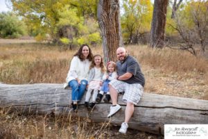 Littleton family photographer Stone House in Lakewood Colorado fall photo session sisters little girls mother father daughters bridge