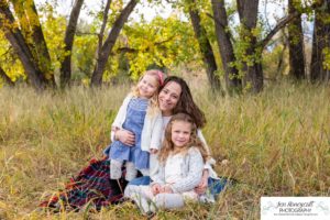 Littleton family photographer Stone House in Lakewood Colorado fall photo session sisters little girls mother father daughters bridge