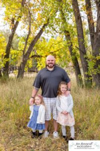 Littleton family photographer Stone House in Lakewood Colorado fall photo session sisters little girls mother father daughters bridge