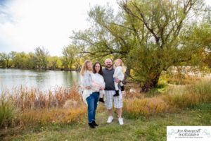 Littleton family photographer Stone House in Lakewood Colorado fall photo session sisters little girls mother father daughters bridge