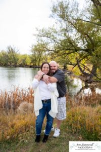 Littleton family photographer Stone House in Lakewood Colorado fall photo session sisters little girls mother father daughters bridge