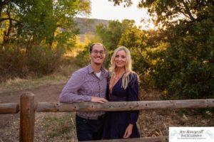 Littleton family photographer Hildebrand Ranch Colorado barn park foothills fall at sunset natural light photography mother father son little boy yellow trees twirling and kisses