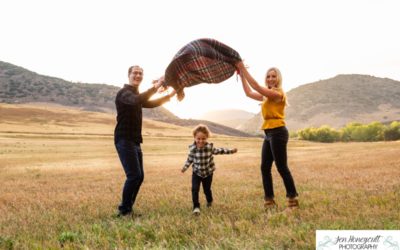 The {L} family of 3 at Hildebrand Ranch for a fall photo session by local Littleton photographer