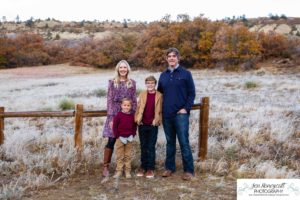 Littleton family photographer in Colorado South Valley Open Space park Ken Caryl red rocks rock formations boys brothers fall photo session cold frost winter mother father sons sunset photography