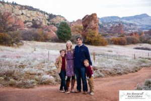 Littleton family photographer in Colorado South Valley Open Space park Ken Caryl red rocks rock formations boys brothers fall photo session cold frost winter mother father sons sunset photography