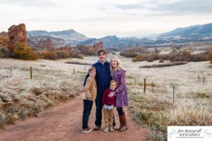 Littleton family photographer in Colorado South Valley Open Space park Ken Caryl red rocks rock formations boys brothers fall photo session cold frost winter mother father sons sunset photography