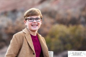 Littleton family photographer in Colorado South Valley Open Space park Ken Caryl red rocks rock formations boys brothers fall photo session cold frost winter mother father sons sunset photography