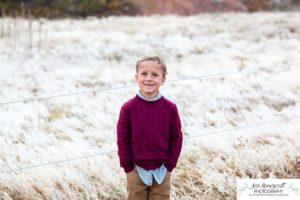 Littleton family photographer in Colorado South Valley Open Space park Ken Caryl red rocks rock formations boys brothers fall photo session cold frost winter mother father sons sunset photography